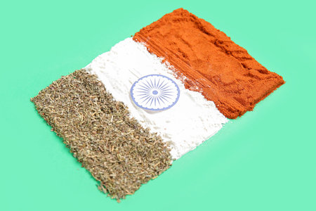 Indian flag made of spices on green backgroundの写真素材