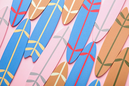 Many different colorful mini surfboards on pink backgroundの写真素材