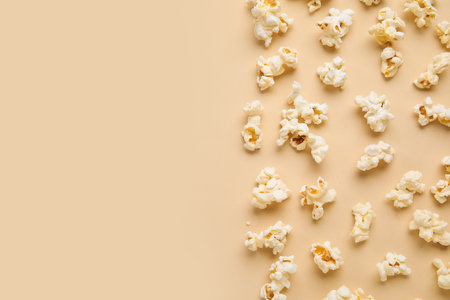Tasty popcorn on beige backgroundの写真素材