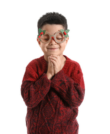 Cute little boy in paper eyeglasses and knitted sweater on white backgroundの写真素材