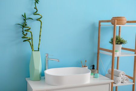 Interior of bathroom with sink and shelving unitの写真素材