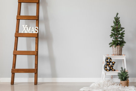 Interior of room with Christmas trees and stepladderの写真素材