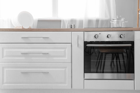 Oven with electric stove and cooking pot in kitchenの写真素材
