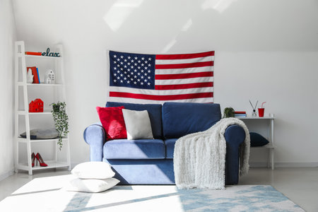 Interior of modern living room with hanging USA flagの写真素材