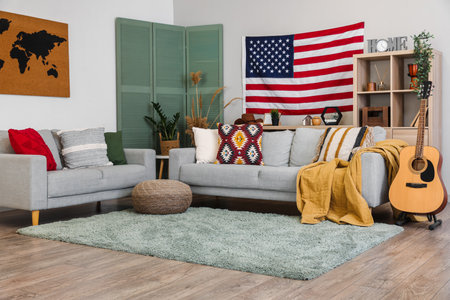 Interior of stylish living room with hanging USA flagの写真素材