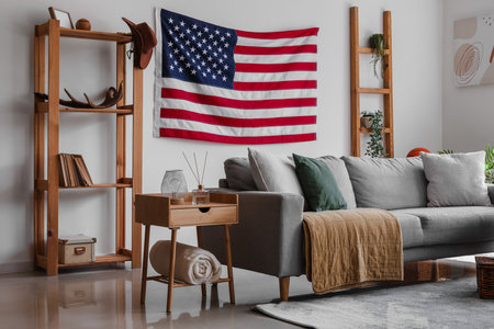 Interior of stylish living room with hanging USA flagの素材 [FY310207749802]