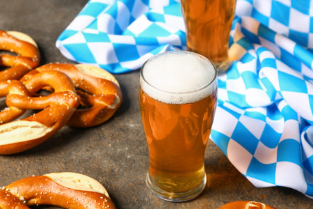 Flag of Bavaria, mug with beer and pretzels on dark backgroundの写真素材