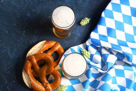 Flag of Bavaria, mugs with beer and pretzels on blue backgroundの写真素材