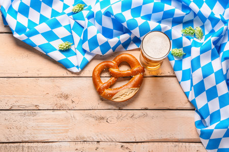 Flag of Bavaria, mug with beer and pretzel on white wooden backgroundの写真素材