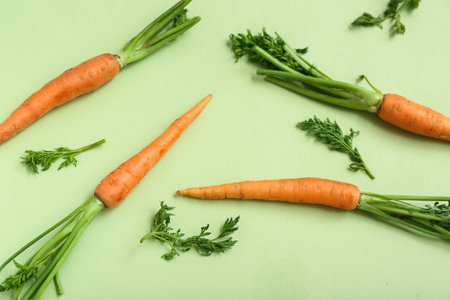 fresh carrots on light green backgroundの写真素材