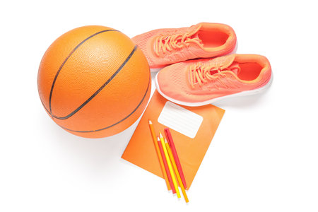 Sneakers with ball and different stationery isolated on white backgroundの写真素材