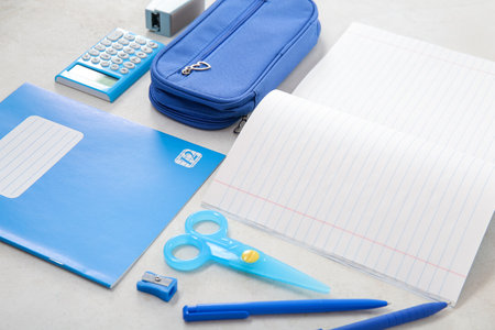 Notebooks with different stationery on white backgroundの写真素材