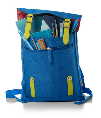 Blue school backpack with notebooks, brushes and markers on white backgroundの写真素材