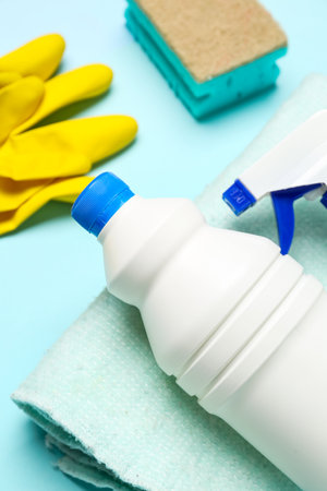 Different cleaning supplies on blue background, closeupの写真素材