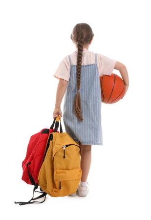 Little schoolgirl with backpacks and ball on white background, back viewの写真素材