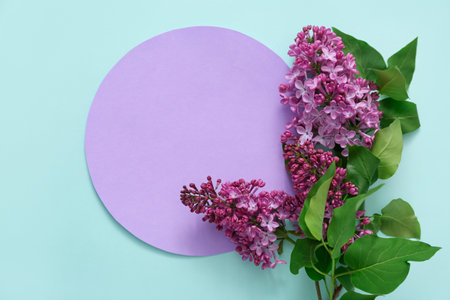 Purple blank card with lilac flowers on pale blue background