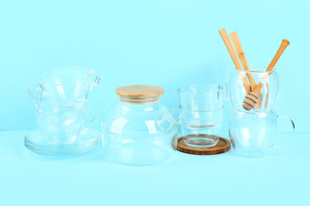 Stylish glass tea set on blue backgroundの写真素材