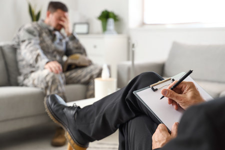 Mature psychologist working with soldier in office, closeupの写真素材