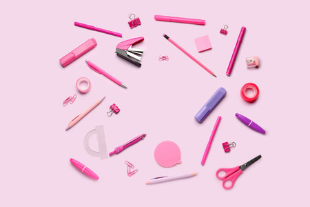 Frame made of stationery supplies on pink backgroundの写真素材