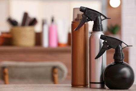 Different hair sprays on table in beauty salonの写真素材
