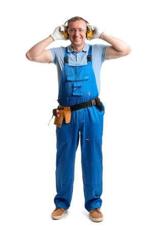 Mature carpenter in hearing protectors on white backgroundの写真素材