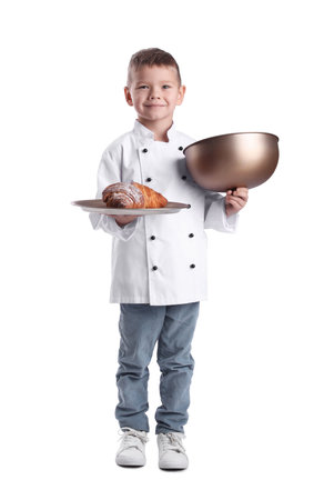 Cute little chef with tray of croissants on white backgroundの写真素材