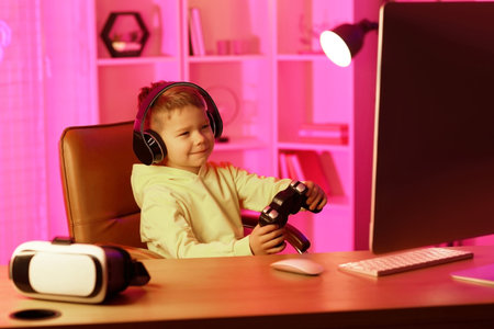 Cute little blogger playing video game at home