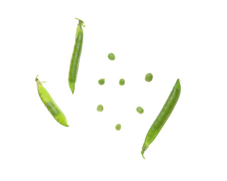 Flying green pea pods on white backgroundの写真素材
