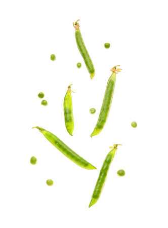 Flying green pea pods on white backgroundの写真素材