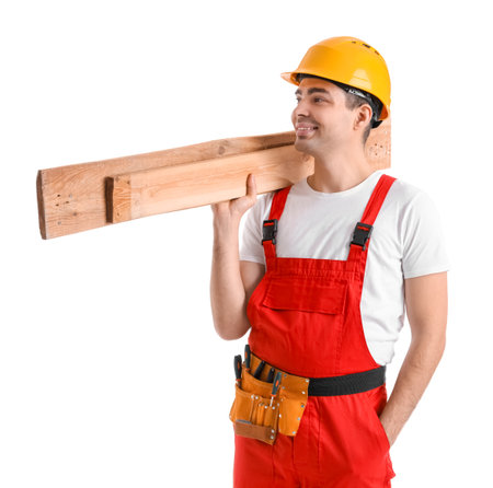 Young carpenter with wooden planks on white backgroundの写真素材