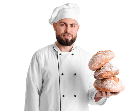 Male baker with loaves of fresh bread on white backgroundの写真素材