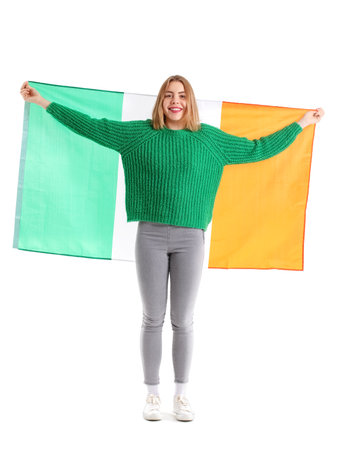 Young woman with flag of Ireland on white backgroundの写真素材