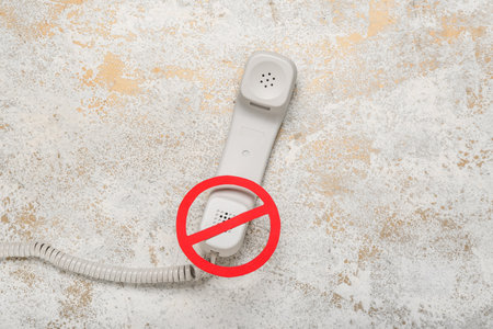 Phone receiver with prohibition sign on grunge background. Censorship conceptの写真素材