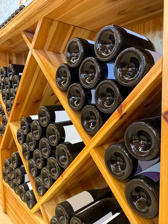 Wooden storage stand with bottles of wine in store