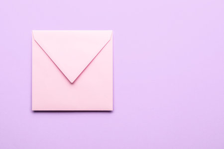 Pink envelope on lilac background. message conceptの写真素材