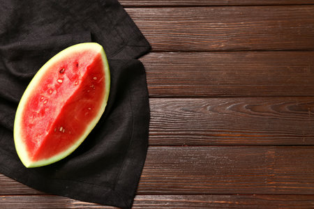 Piece of fresh watermelon on wooden backgroundの写真素材