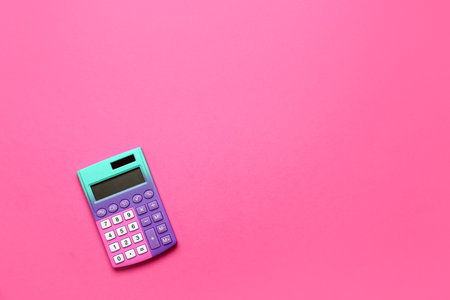Modern calculator on pink backgroundの写真素材