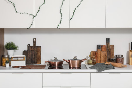 Cutting boards with food and utensils on counter in kitchenの写真素材