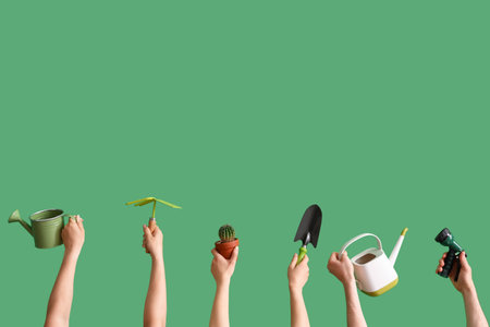 People with gardening tools and cactus on green backgroundの写真素材