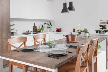 Interior of modern kitchen with served island tableの写真素材