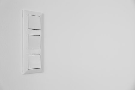 Modern switches on white wallの写真素材