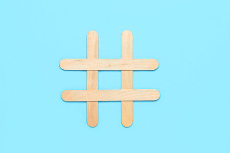Composition with ice cream sticks on color background