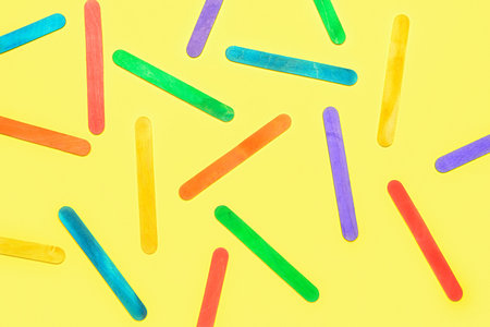 Colorful ice cream sticks on beige backgroundの写真素材