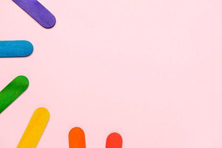Colorful ice cream sticks on pink backgroundの写真素材