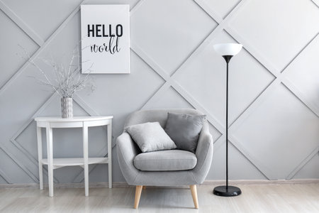 Interior of modern room with comfortable armchair and tableの写真素材