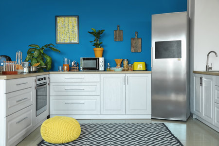 Stylish interior of modern kitchen with big refrigeratorの写真素材