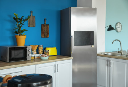 Stylish interior of modern kitchen with big refrigeratorの写真素材