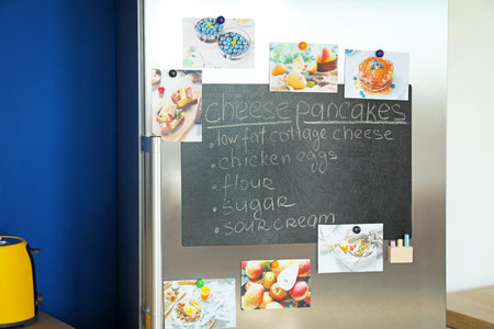 Chalkboard on door of refrigerator in kitchenの写真素材