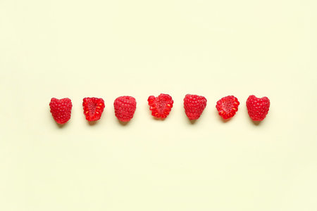 Fresh raspberries on light backgroundの写真素材