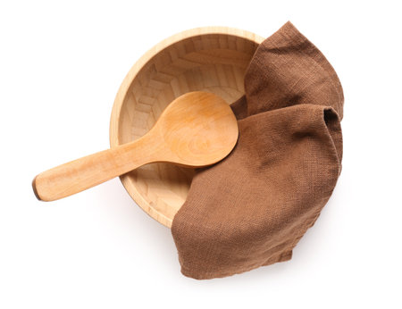 Wooden bowl, spoon and napkin on white backgroundの写真素材